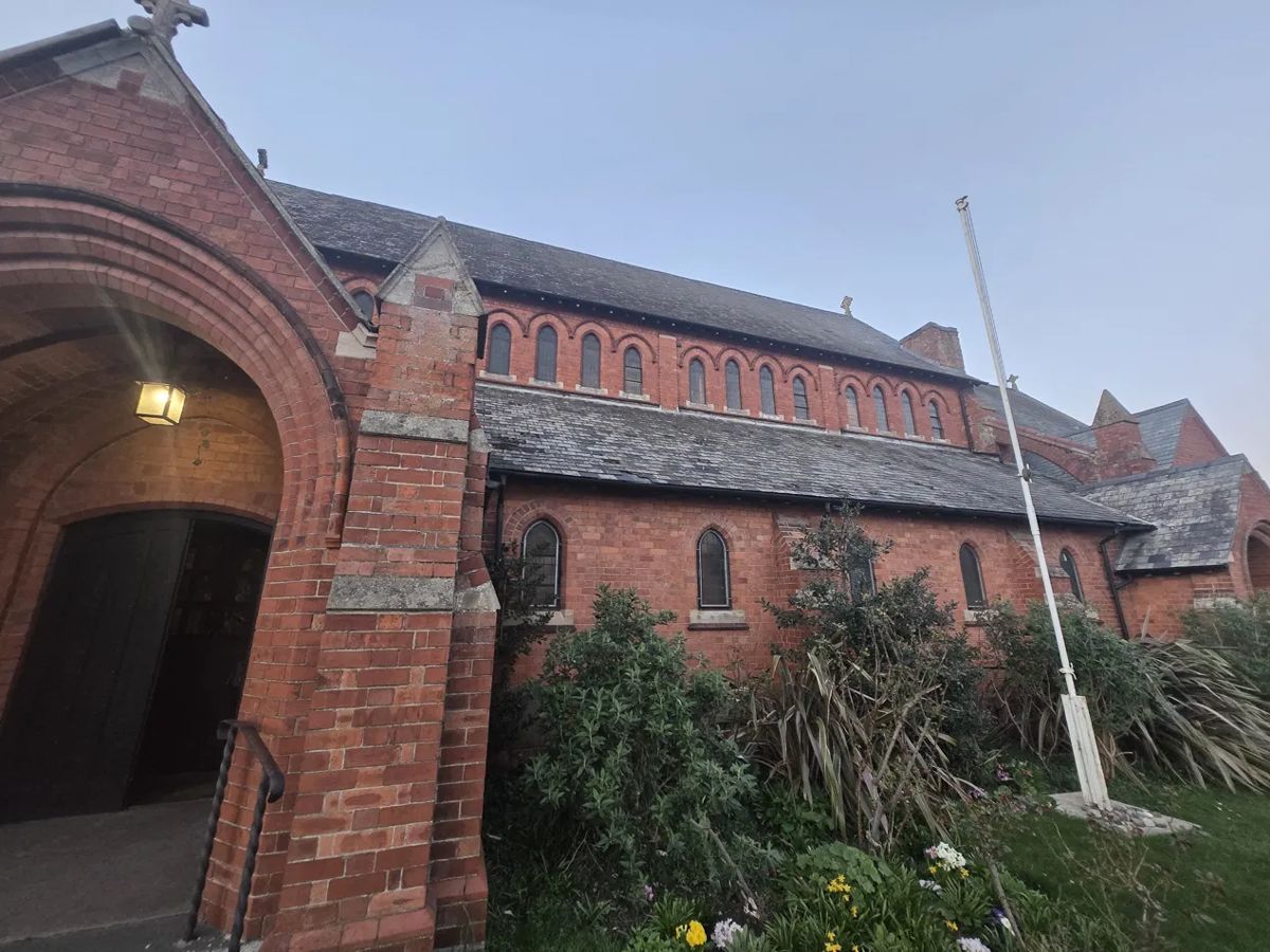 The red brick exterior of St Philip the Deacon church, Upper Stratton